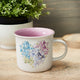 Violet Floral Heart Coffee Mug on Table
